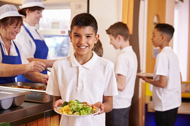 Boy holding school meal